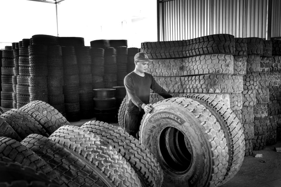 Tires stacked neatly in a storage warehouse